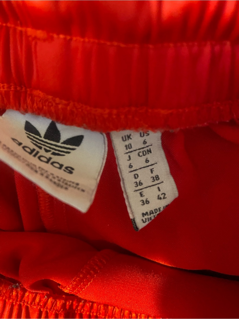 Red Adidas track pants